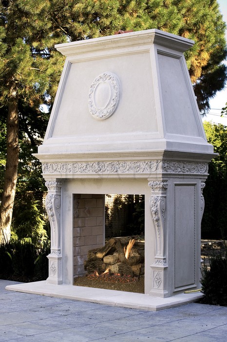 Exterior mantel beside a pool